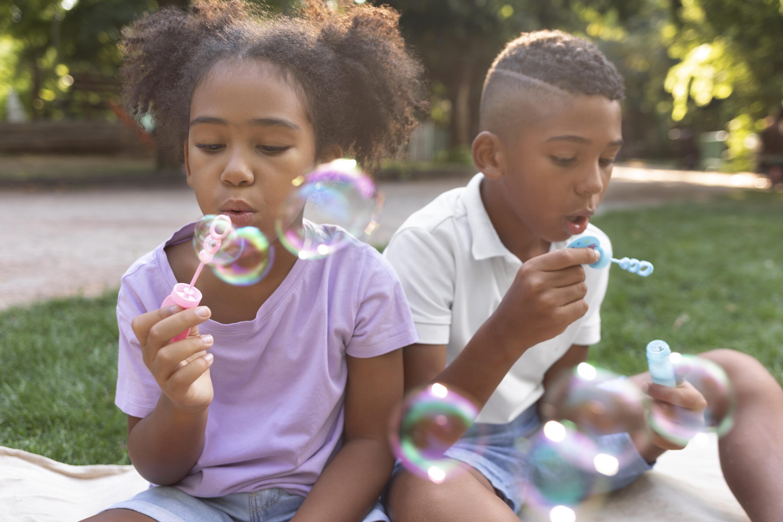 medium shot kids making soap bubbles