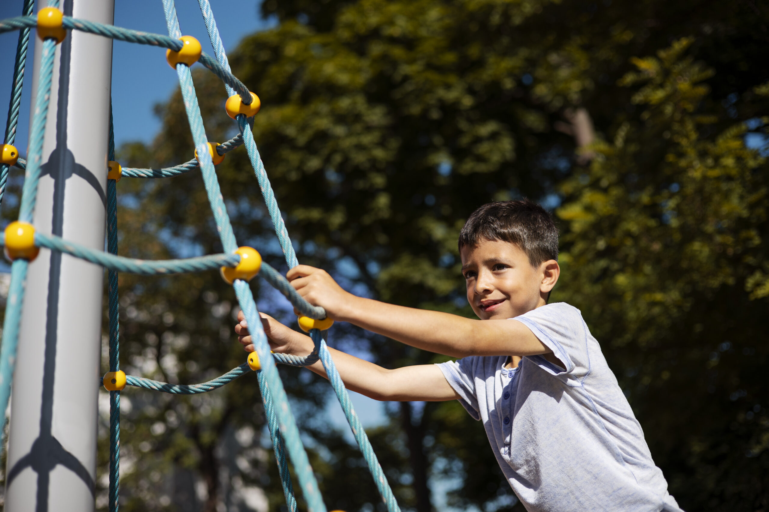 young boy having fun playground